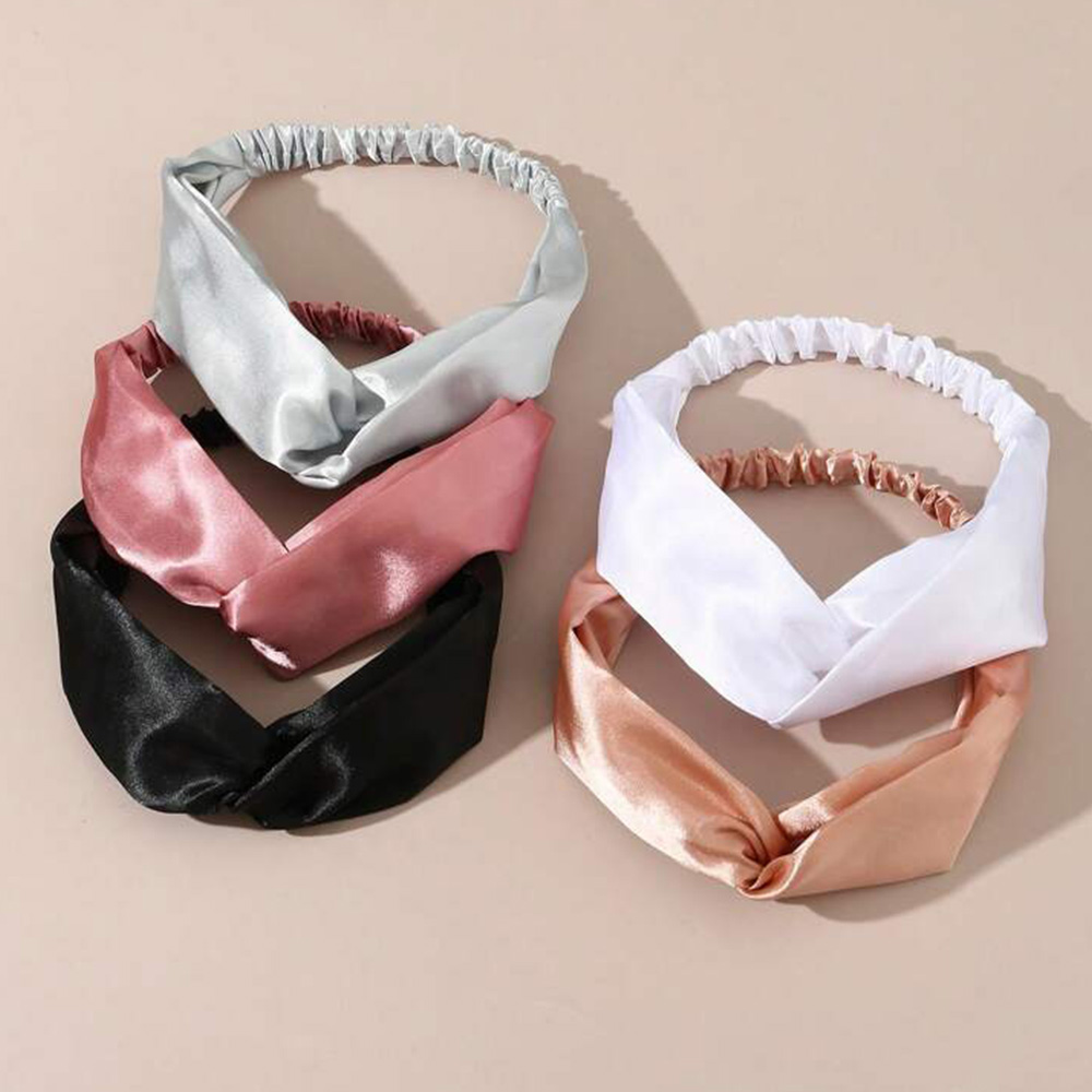 Assorted cross knot mulberry silk headbands flat lay