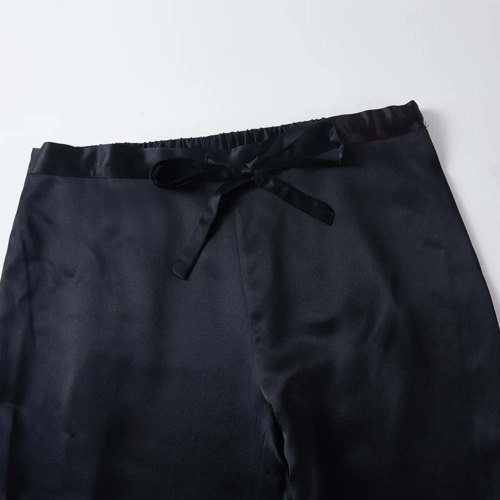 Drawstring waistband detail on men's silk pajama pants